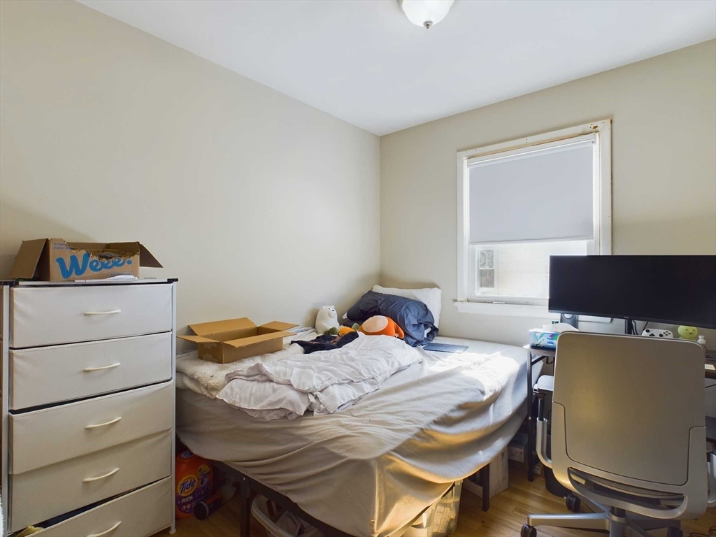 24 Chester Street Boston, MA 02134 - Photo 15 of 23 a bed room with a bed and a window