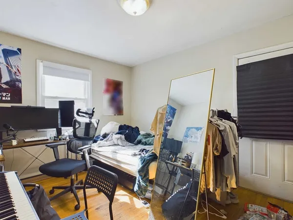 a view of a workspace with furniture and gym equipment
