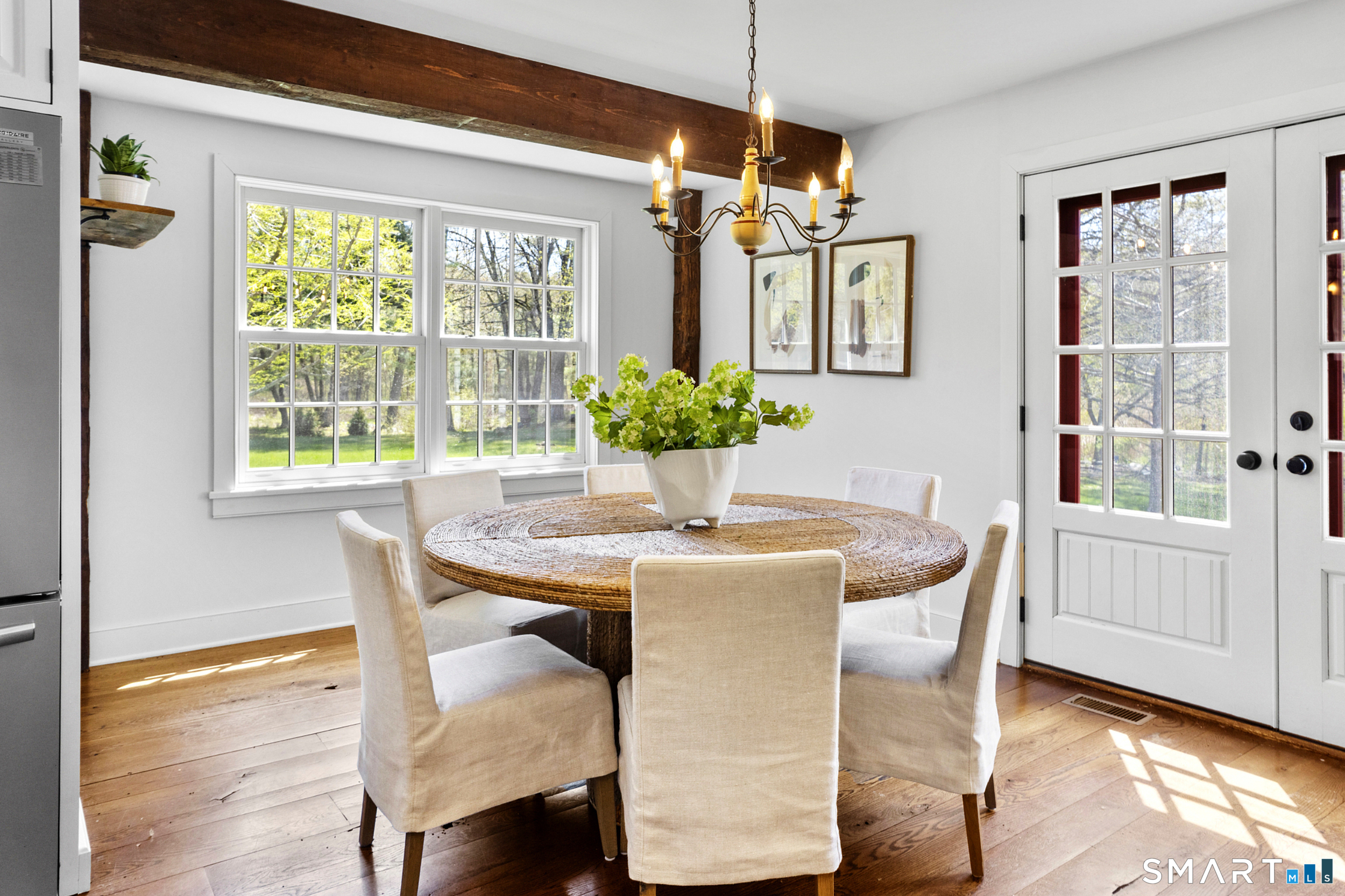 3808 Redding Road Fairfield, CT 06824 - Photo 16 of 40 a view of a dining room with furniture window and wooden floor