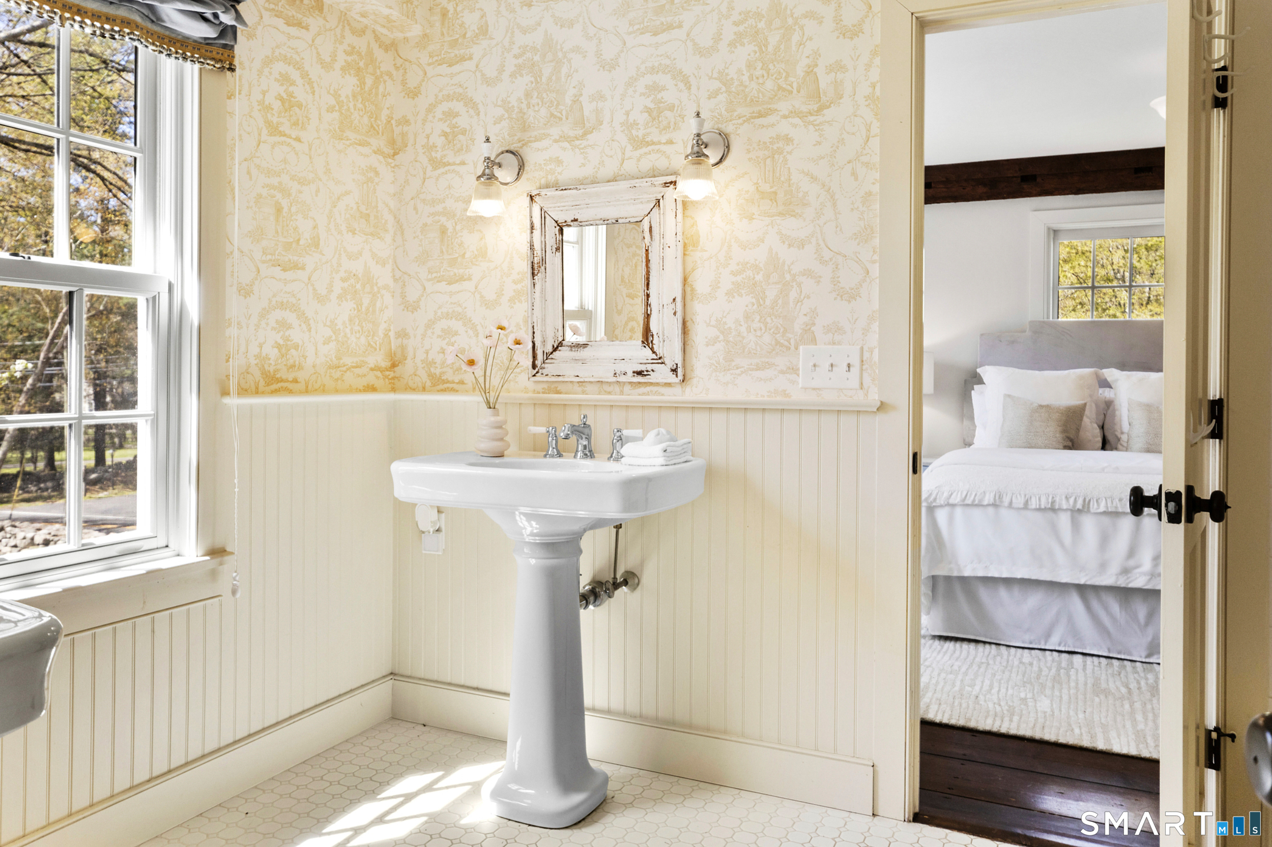 3808 Redding Road Fairfield, CT 06824 - Photo 28 of 40 a bathroom with a sink and a mirror
