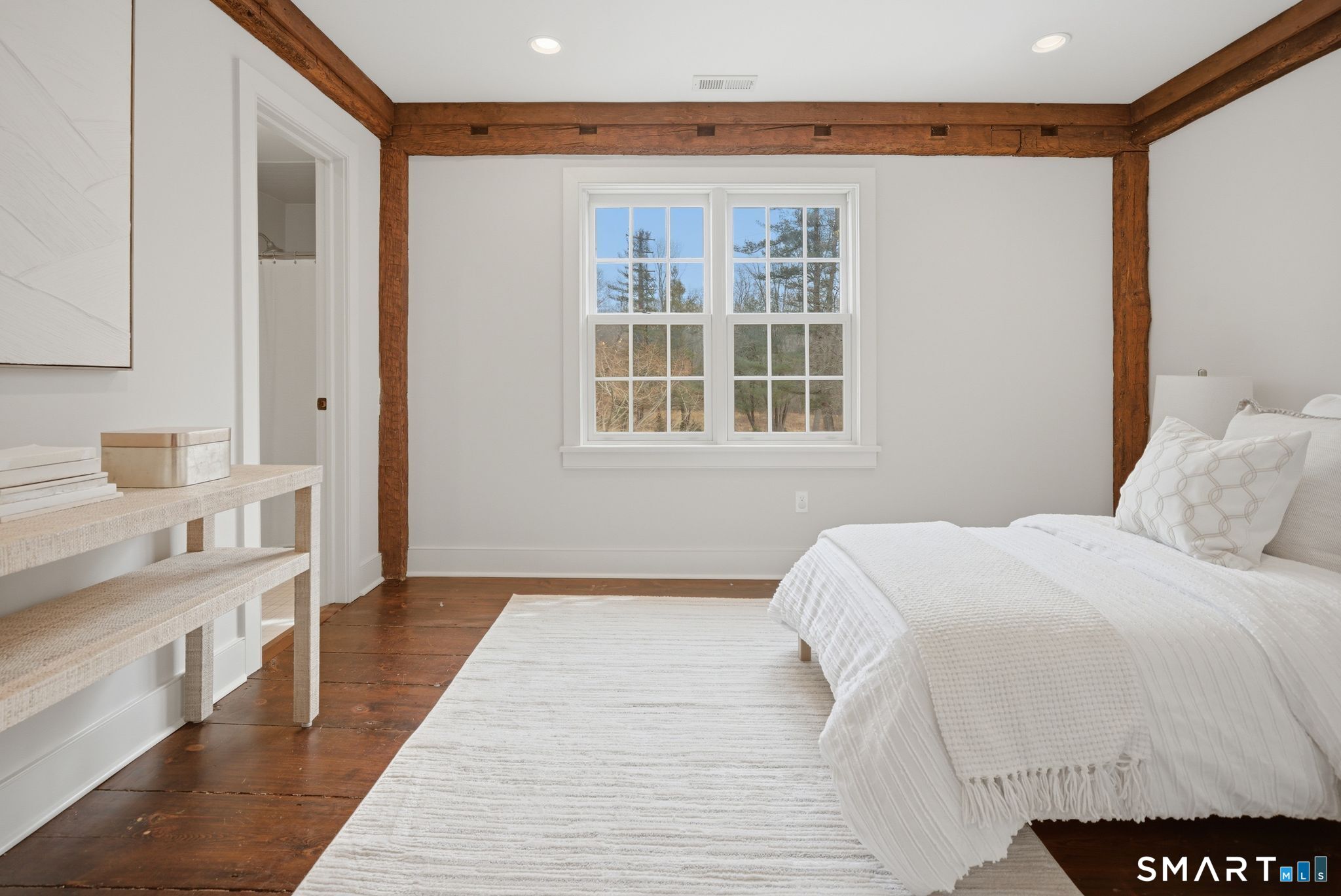 3808 Redding Road Fairfield, CT 06824 - Photo 29 of 40 a bedroom with a large bed and a window