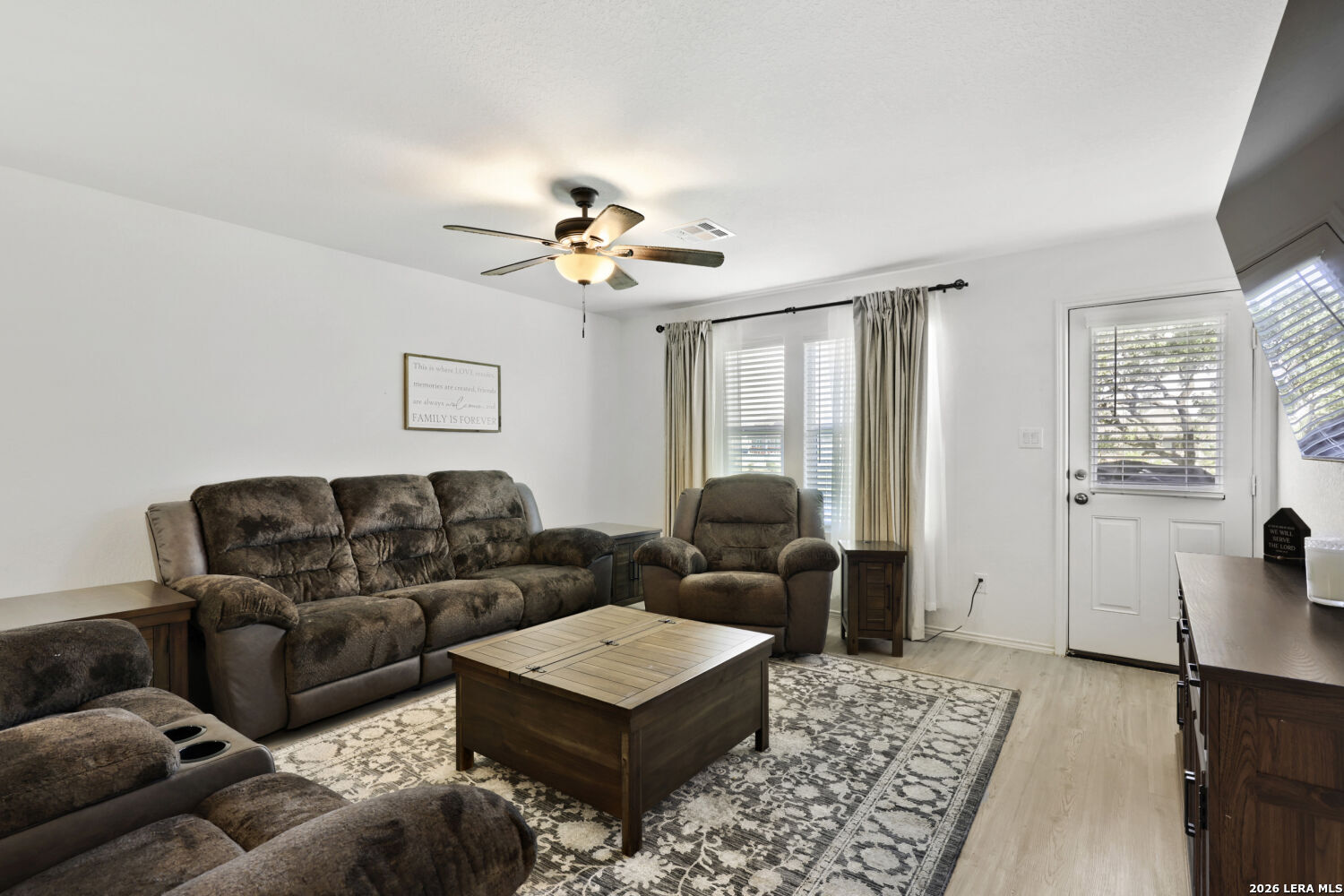 6017 Companion Loop Bulverde, TX 78163 - Photo 7 of 38 a living room with furniture ceiling fan and a window