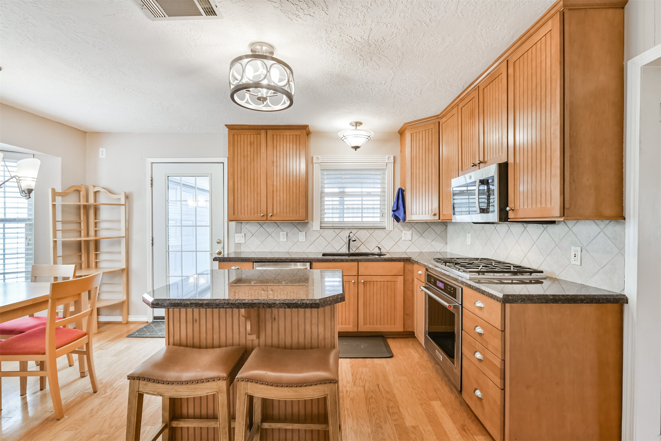 2511 Watts Street Houston, TX 77030 - Photo 10 of 34 Lovely kitchen with an island and breakfast room for those informal meals you whip up in your new kitchen.