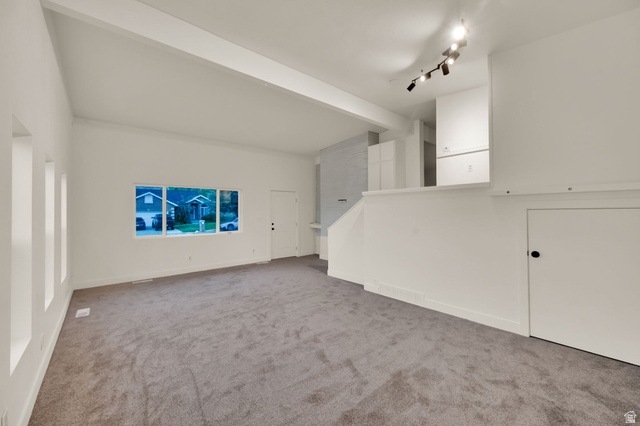 360 400 North Centerville, UT 84014 - Photo 18 of 30 Spacious living area featuring neutral carpeting and white painted walls