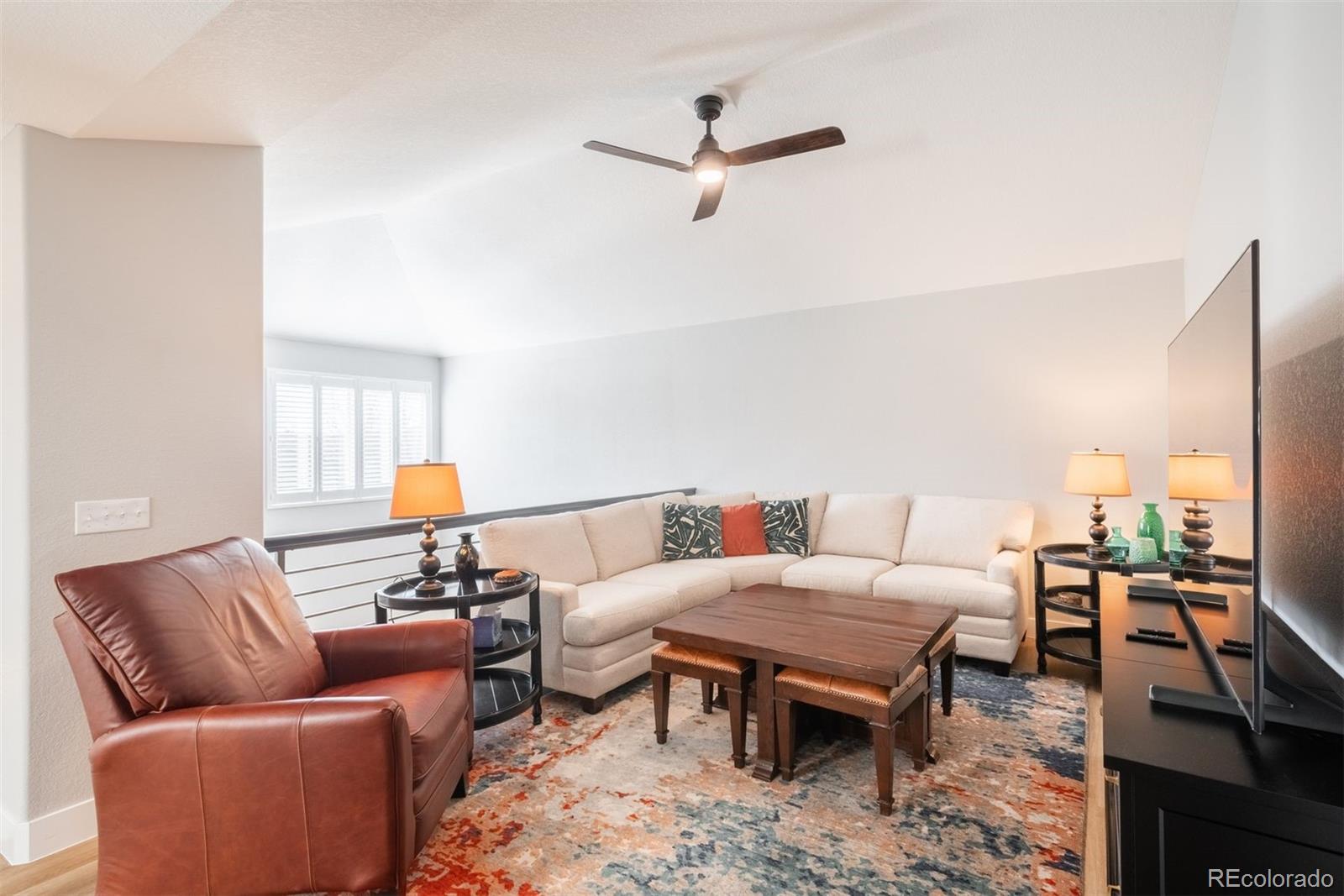 8555 Gold Peak Drive, Unit B Highlands Ranch, CO 80130 - Photo 19 of 38 a living room with furniture and a table