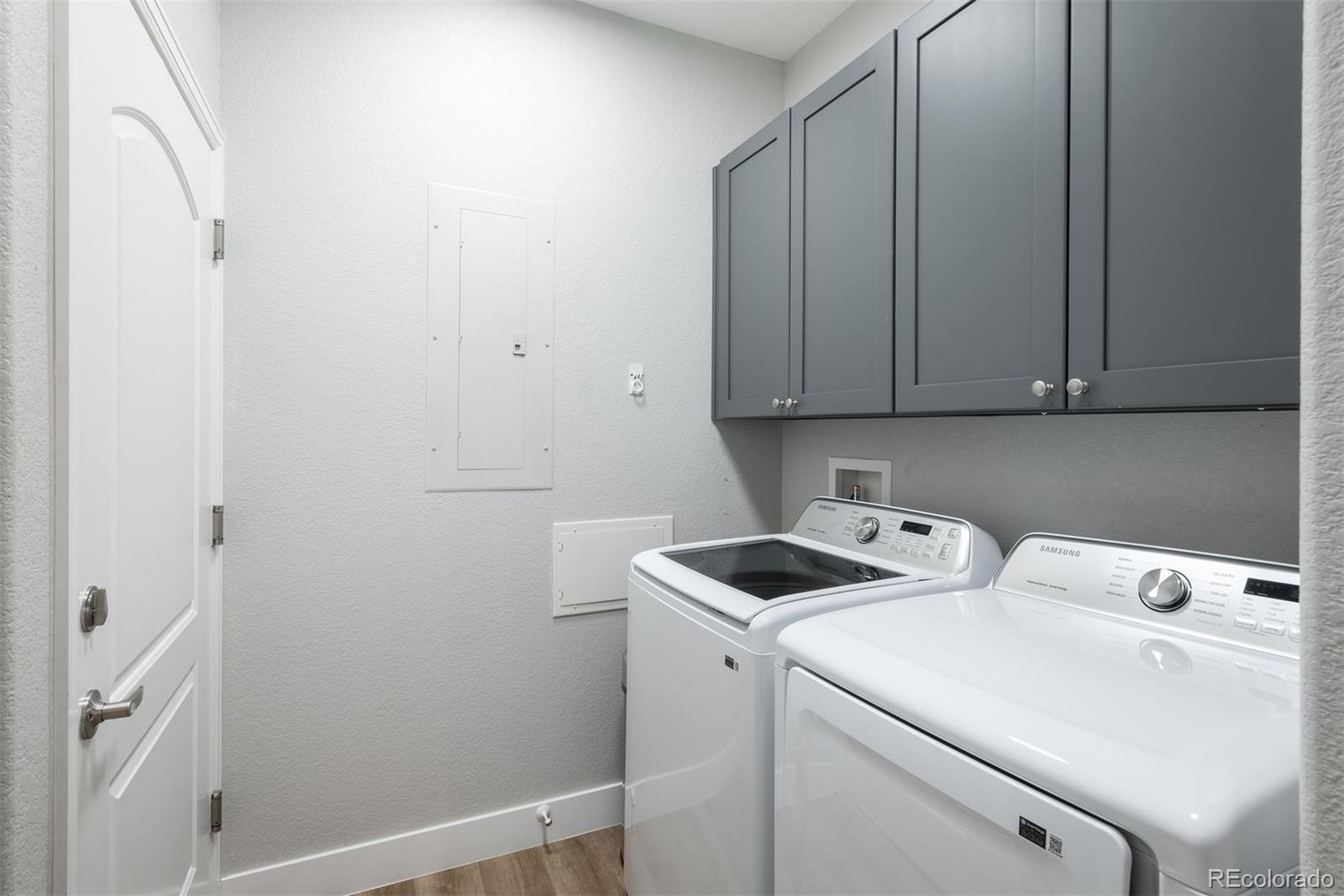 8555 Gold Peak Drive, Unit B Highlands Ranch, CO 80130 - Photo 25 of 38 a view of storage and utility room with washer and dryer