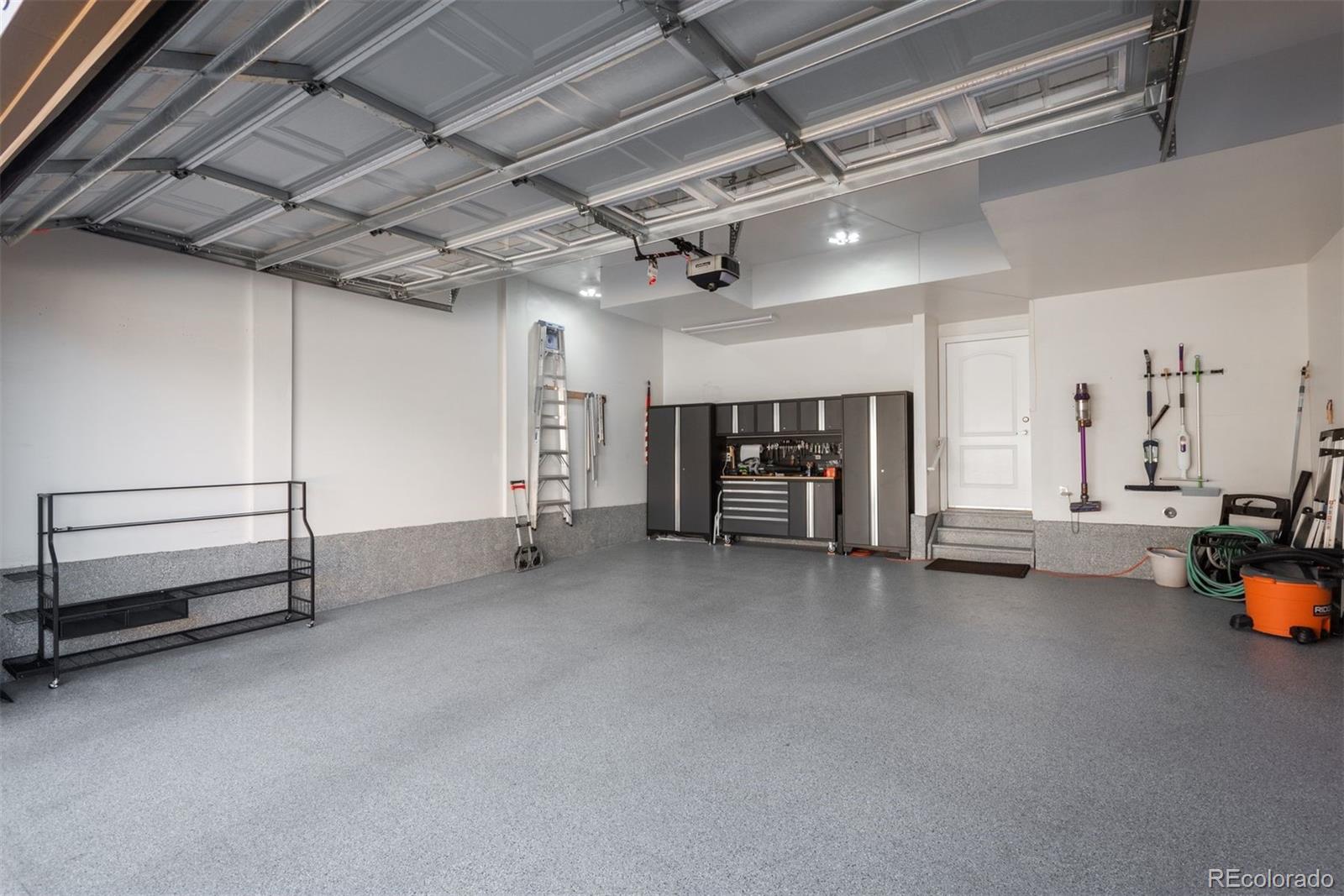 8555 Gold Peak Drive, Unit B Highlands Ranch, CO 80130 - Photo 27 of 38 a view of a livingroom with furniture and a ceiling fan
