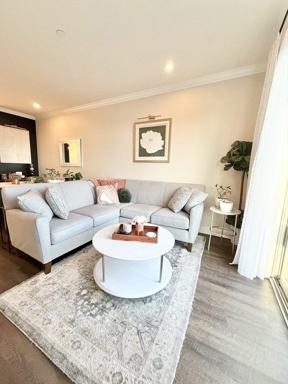 69 Foundry Street, Unit 416 Wakefield, MA 01880 - Photo 11 of 21 a living room with furniture and a couch