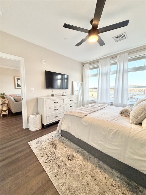 69 Foundry Street, Unit 416 Wakefield, MA 01880 - Photo 14 of 21 a spacious bedroom with a bed and a flat screen tv