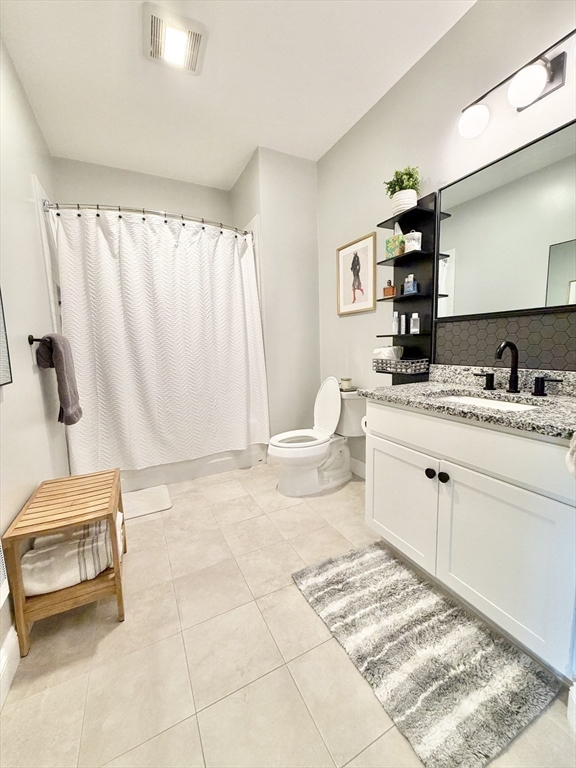 69 Foundry Street, Unit 416 Wakefield, MA 01880 - Photo 16 of 24 a bathroom with a sink toilet and shower