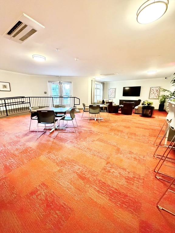 69 Foundry Street, Unit 416 Wakefield, MA 01880 - Photo 17 of 21 a view of a house with a patio