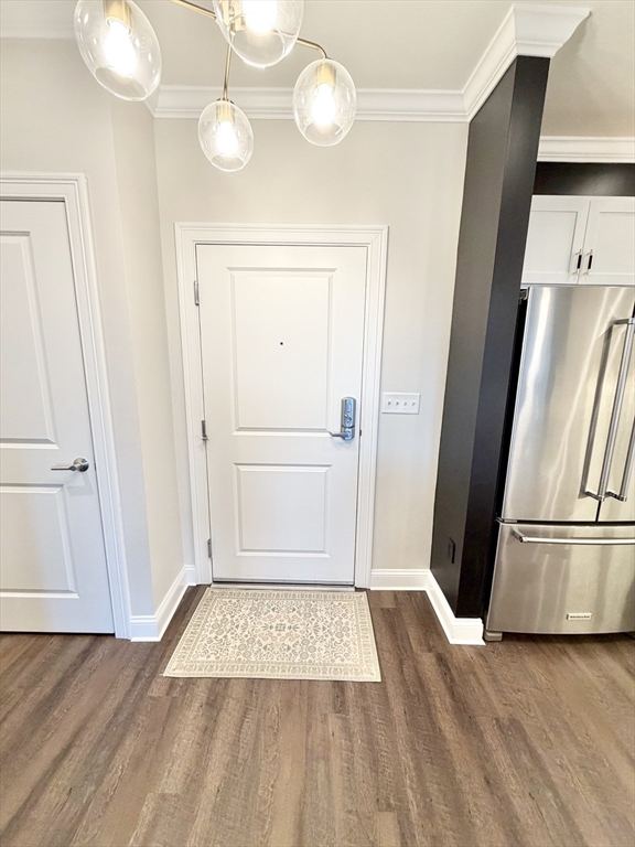 69 Foundry Street, Unit 416 Wakefield, MA 01880 - Photo 2 of 21 wooden floor in an empty room with a window