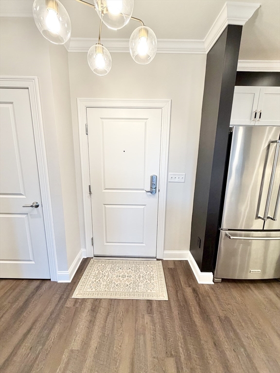 69 Foundry Street, Unit 416 Wakefield, MA 01880 - Photo 3 of 24 wooden floor in an empty room with a window