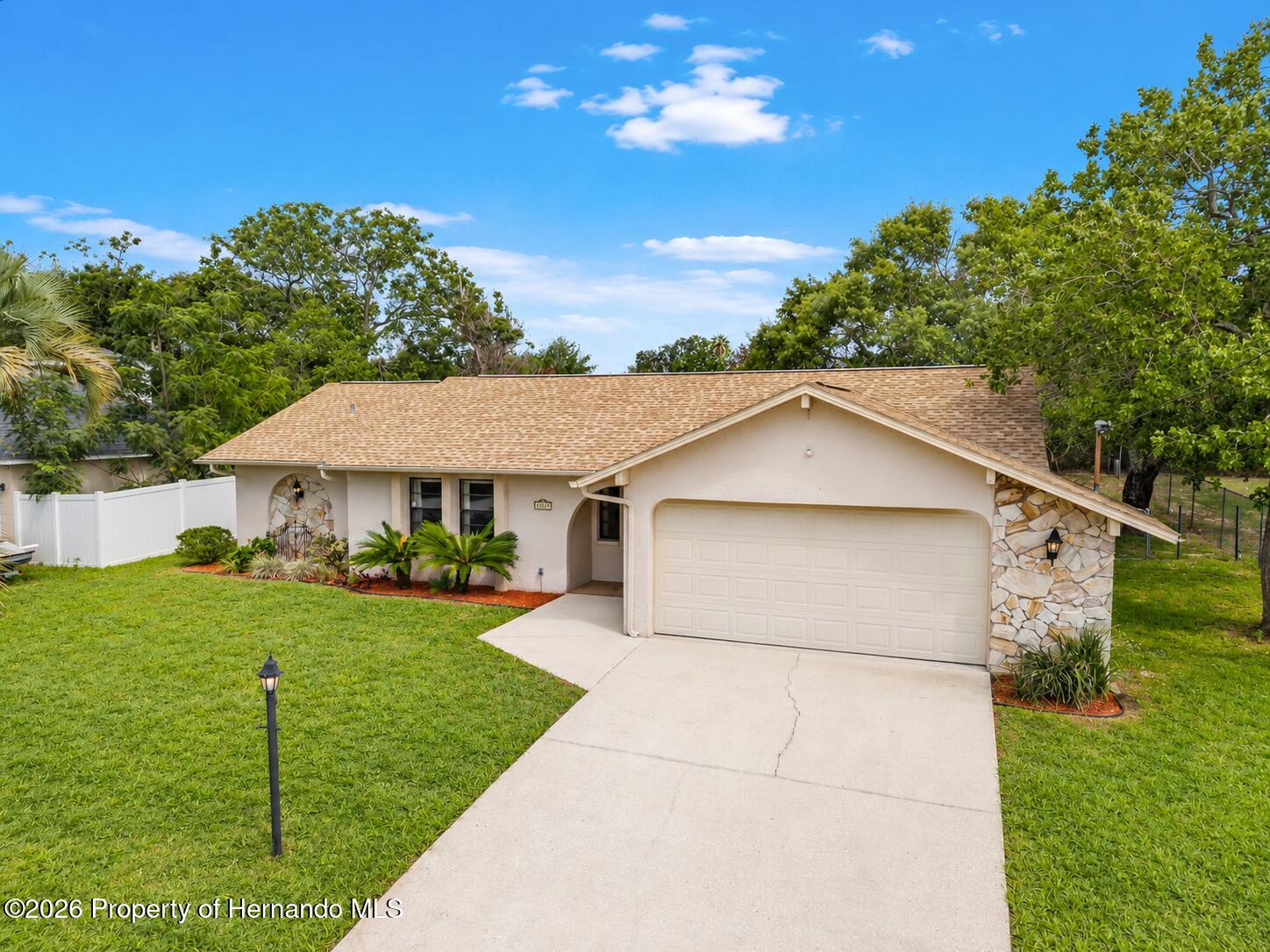 11312 Sedgefield Avenue Spring Hill, FL 34608 - Photo 3 of 28 stone accents, fenced yard & arched entryway