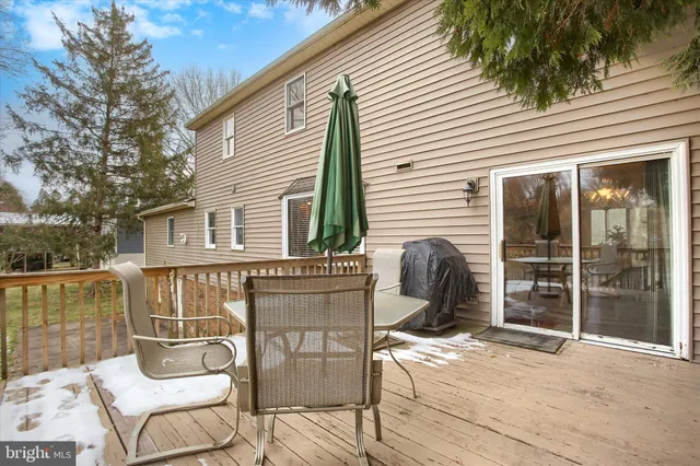 a view of a patio with couches chairs and a potted plant