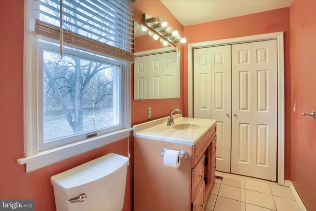 a bathroom with a sink a vanity and a mirror