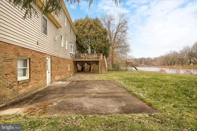 a view of a lake with houses in the back