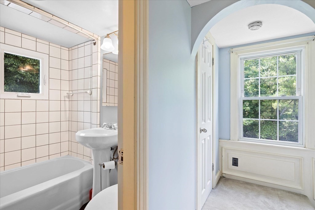 23 Fay Street Chicopee, MA 01020 - Photo 16 of 32 a bathroom with a bathtub and shower