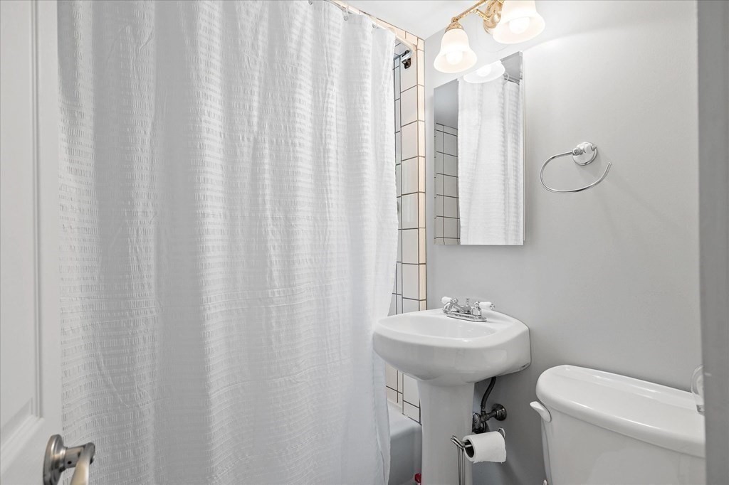 23 Fay Street Chicopee, MA 01020 - Photo 17 of 32 a bathroom with a sink a toilet and shower