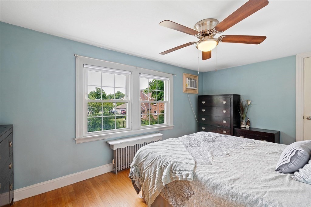 23 Fay Street Chicopee, MA 01020 - Photo 18 of 32 a bedroom with a large bed and a window