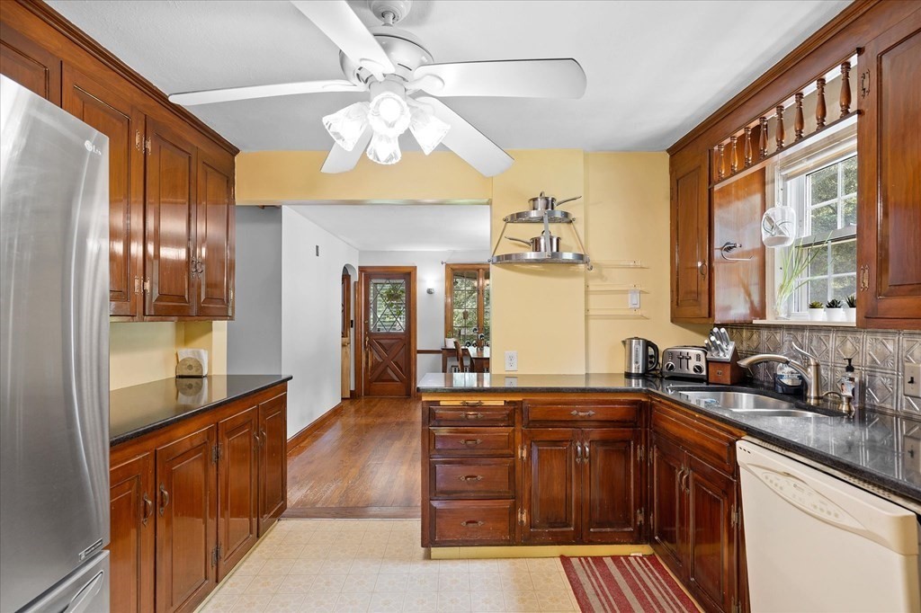 23 Fay Street Chicopee, MA 01020 - Photo 8 of 32 a kitchen with stainless steel appliances a sink stove and cabinets
