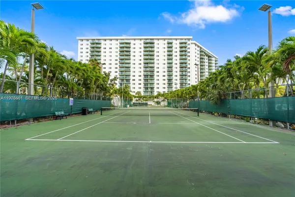 a view of an outdoor space and tennis court