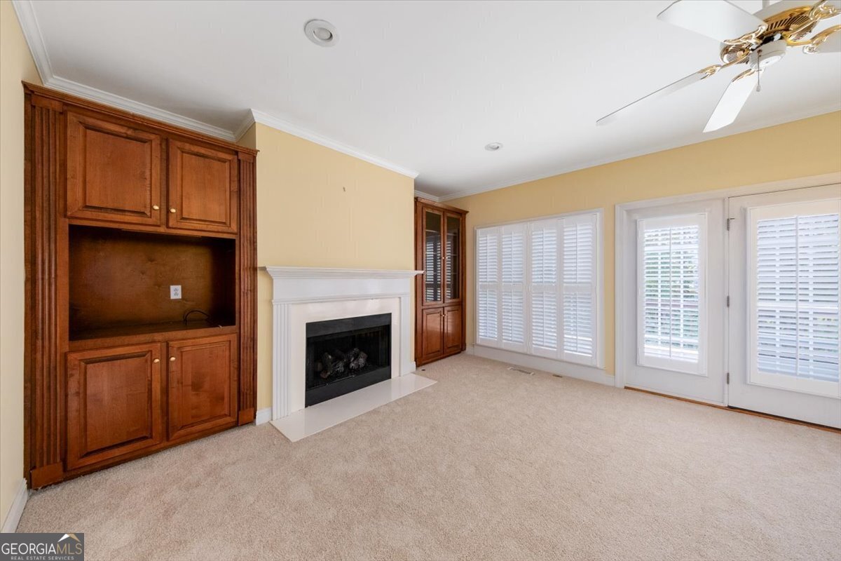 112 Covington Place Macon, GA 31210 - Photo 17 of 76 a view of an empty room with a fireplace and a window