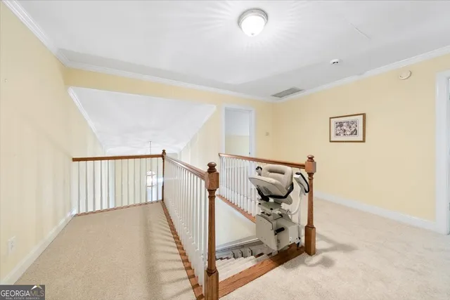 a kitchen with stainless steel appliances granite countertop a refrigerator a sink a stove and a wooden floors