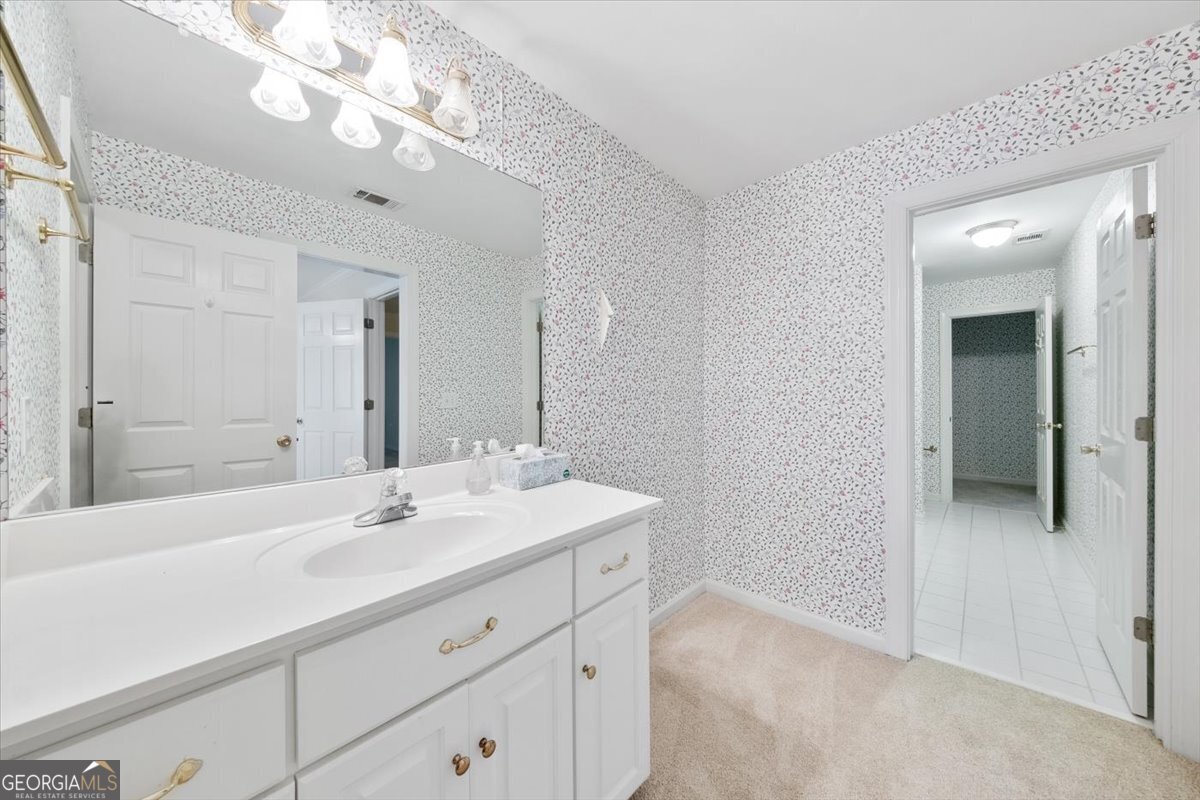 112 Covington Place Macon, GA 31210 - Photo 37 of 76 a bathroom with a sink a large mirror and a shower