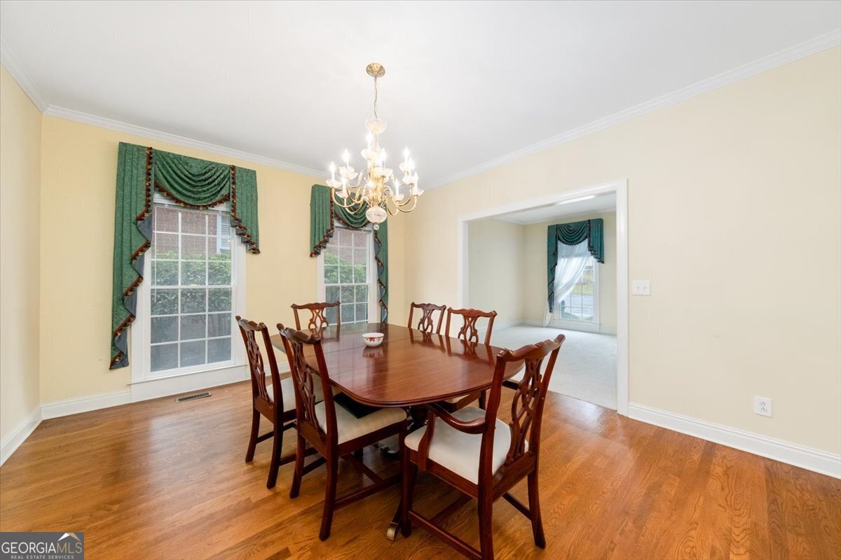 112 Covington Place Macon, GA 31210 - Photo 38 of 76 a view of a dining room with furniture wooden floor and chandelier