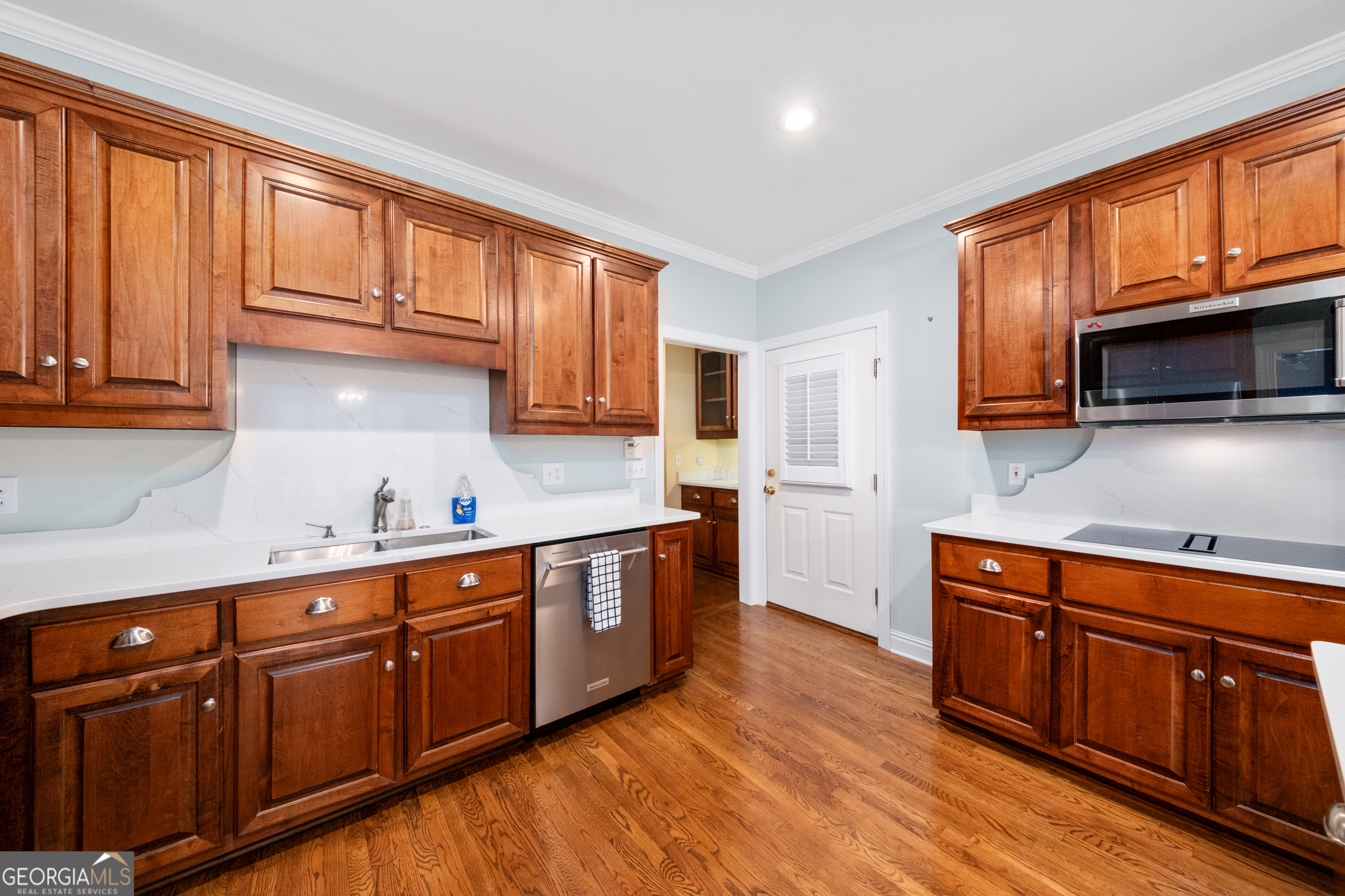 112 Covington Place Macon, GA 31210 - Photo 50 of 76 a kitchen with stainless steel appliances granite countertop wooden cabinets a sink and dishwasher a stove top oven with wooden floor