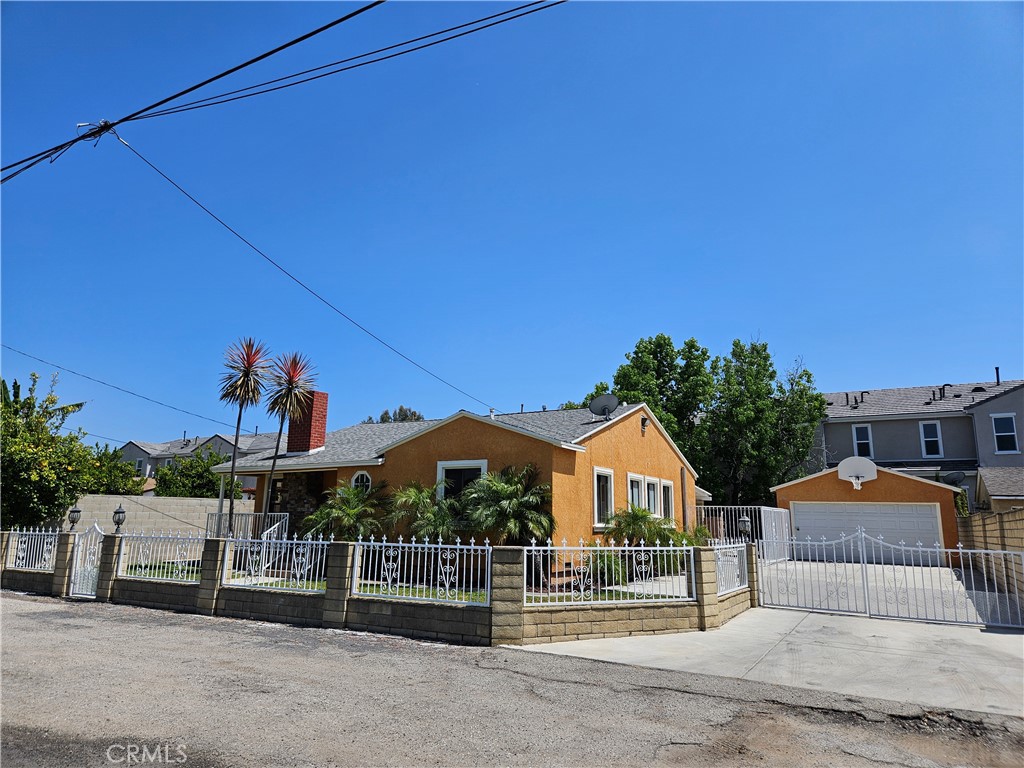 11227 Gladhill Road Whittier, CA 90604 - Photo 1 of 1 a front view of a house with a garden
