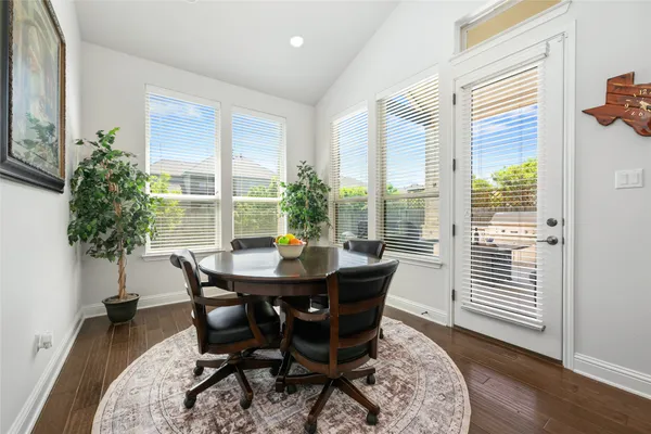 a kitchen with stainless steel appliances granite countertop a sink a stove and refrigerator