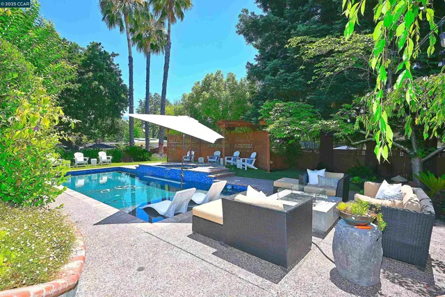 a view of a swimming pool with a patio