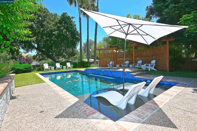 a outdoor dining space with furniture and garden view