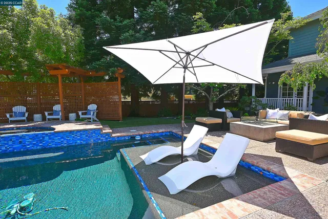 a view of a patio with a table chairs and a patio