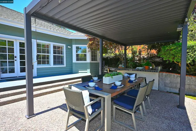 a outdoor dining space with furniture and outdoor space