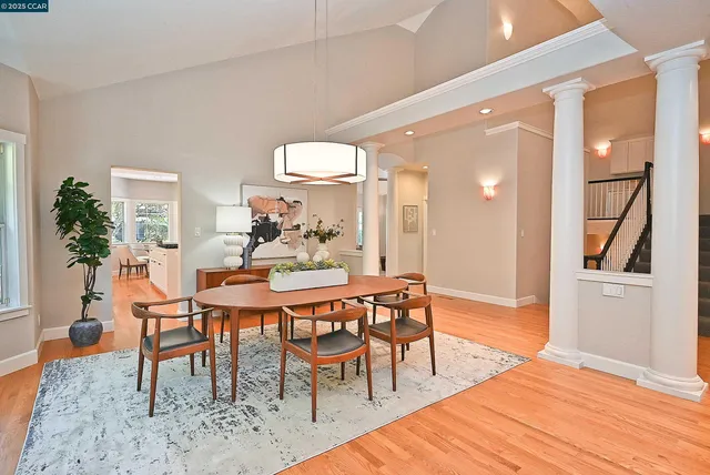a dining room with furniture and window