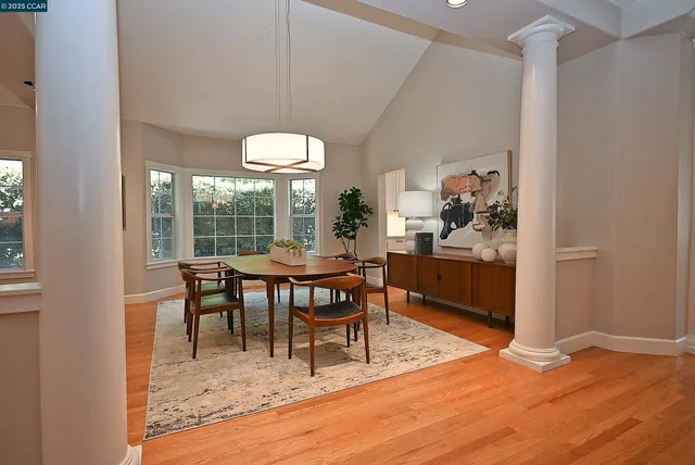 a view of a dining room with furniture window and outside view
