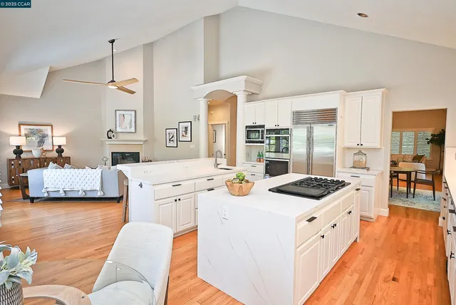 a kitchen that has a stove and a table