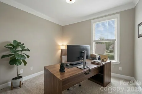 a view of a workspace with furniture