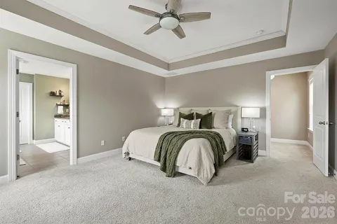 a bathroom with a granite countertop sink mirror and shower