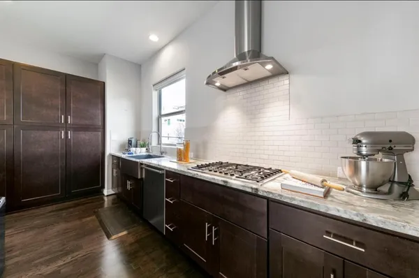 a view of bathroom with granite countertop sink