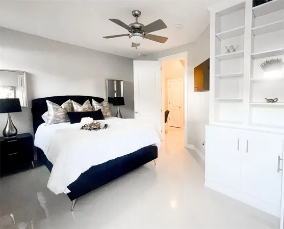 a bathroom with a granite countertop sink toilet a large mirror a shower and vanity
