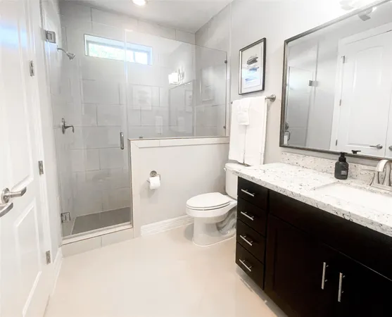 a bathroom with a tub a sink and a mirror