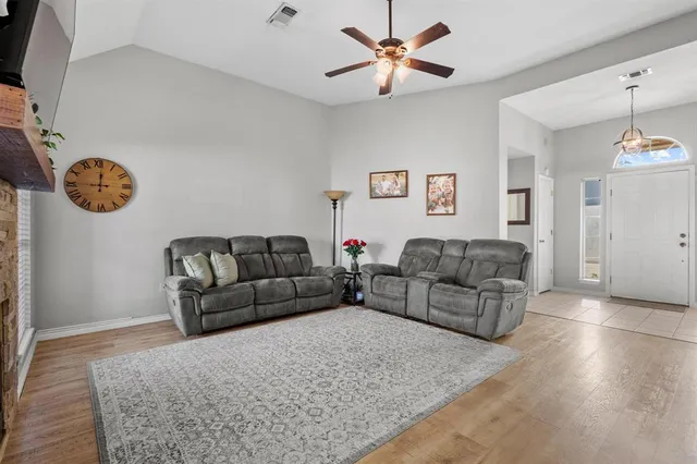 a living room with couches and a fireplace