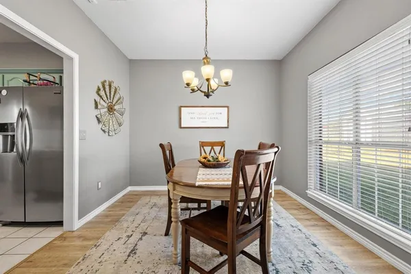 a kitchen with stainless steel appliances a sink a stove top oven a counter space and cabinets