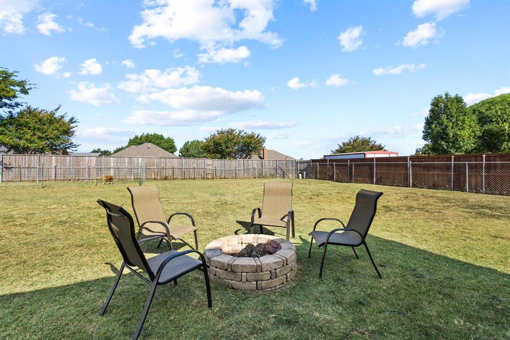 406 Sunshine Trail Bells, TX 75414 - Photo 30 of 37 a view of a lake with table and chairs
