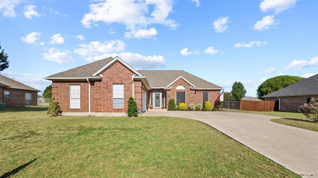 406 Sunshine Trail Bells, TX 75414 - Photo 3 of 37 a front view of a house with a yard and garage