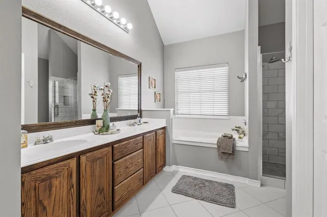 a bathroom with a granite countertop sink mirror and toilet